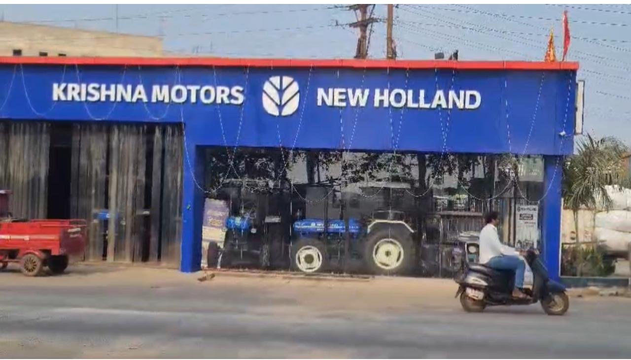 Krishna Motors New Holland dealership with branded blue fascia