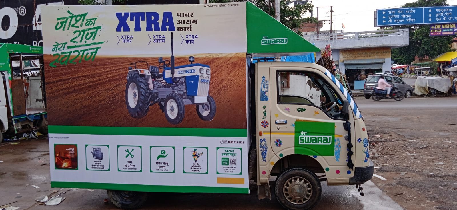 Swaraj XTRA LED van on a town road